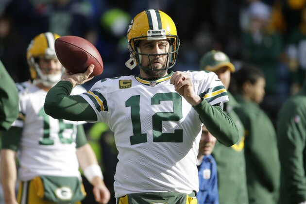 Green Bay Packers quarterback Aaron Rodgers (12) warms up before the NFL football NFC Championship game against the Seattle Seahawks Sunday, Jan. 18, 2015, in Seattle. (AP Photo/Ted S. Warren)