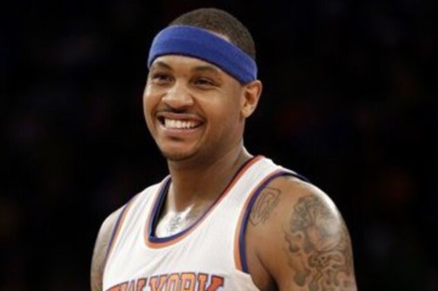 FILE - In this Feb. 1, 2015 file photo, New York Knicks' Carmelo Anthony smiles during the second half of the NBA basketball game against the Los Angeles Lakers, in New York. The NBA star announced Thursday, June 11, 2015, that he is bringing a professional soccer team to Puerto Rico for the first time in three years. (AP Photo/Seth Wenig, File)