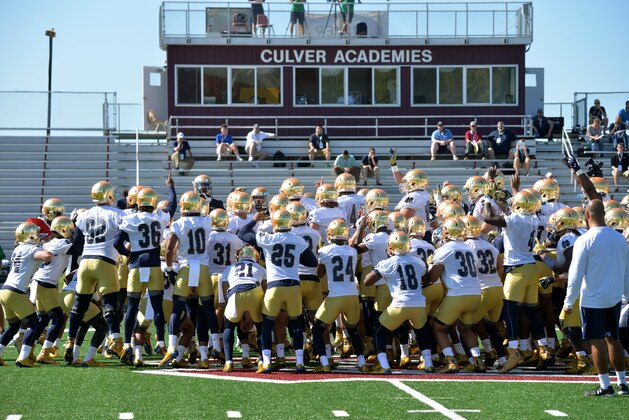 Notre Dame players perform a pre-practice cheer during an NCAA football training camp Friday, Aug. 7, 2015, in Culver, Ind. (AP Photo/Joe Raymond)