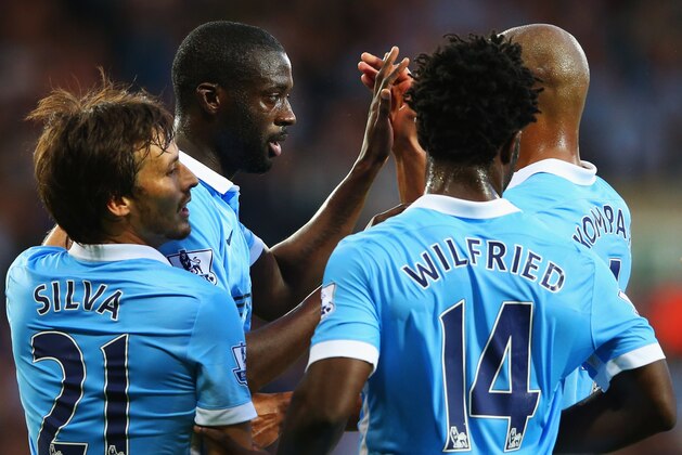 WEST BROMWICH, ENGLAND - AUGUST 10:  Yaya Toure of Manchester City (2L) celebrates with team mates David Silva (L), Wilfred Bony (2R) and Vincent Kompany (R) as he scores their second goal during the Barclays Premier League match between West Bromwich Albion and Manchester City at The Hawthorns on August 10, 2015 in West Bromwich, England.  (Photo by Alex Livesey/Getty Images)