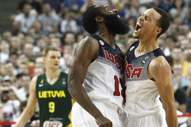 US forward James Harden (L) and US guard Stephen Curry (R) celebrate after scoring during the 2014 FIBA World basketball championships semifinal match Lithuania vs USA at the Palau Sant Jordi in Barcelona on September 11, 2014.    AFP PHOTO/ QUIQUE GARCIA        (Photo credit should read QUIQUE GARCIA/AFP/Getty Images)