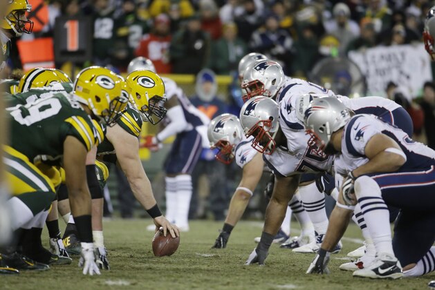 Players line up during the second half of an NFL football game between the Green Bay Packers and the New England Patriots Sunday, Nov. 30, 2014, in Green Bay, Wis. (AP Photo/Morry Gash)
