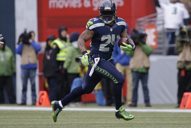 Seattle Seahawks running back Marshawn Lynch (24) runs against the Green Bay Packers during the first half of the NFL football NFC Championship game Sunday, Jan. 18, 2015, in Seattle. (AP Photo/Jeff Chiu)