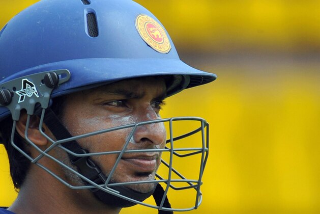 Sri Lankan cricketer Kumar Sangakkara watches colleagues during a net practice session at the R. Premadasa Stadium in Colombo on July 21, 2008. The Sri Lankan cricket team will play five One Day International (ODI) matches and three Test matches against India starting July 23. AFP PHOTO/Lakruwan WANNIARACHCHI (Photo credit should read LAKRUWAN WANNIARACHCHI/AFP/Getty Images)