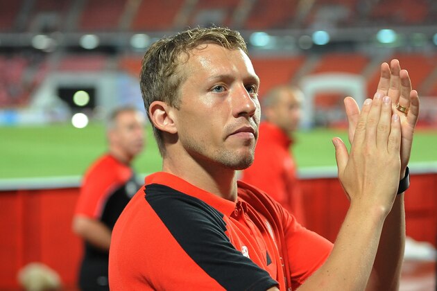 BANGKOK, THAILAND - JULY 14: Lucas Leiva of Liverpool greets the fans after the international friendly match between Thai Premier League All Stars and Liverpool FC at Rajamangala Stadium on July 14, 2015 in Bangkok, Thailand.  (Photo by Robertus Pudyanto/Getty Images)