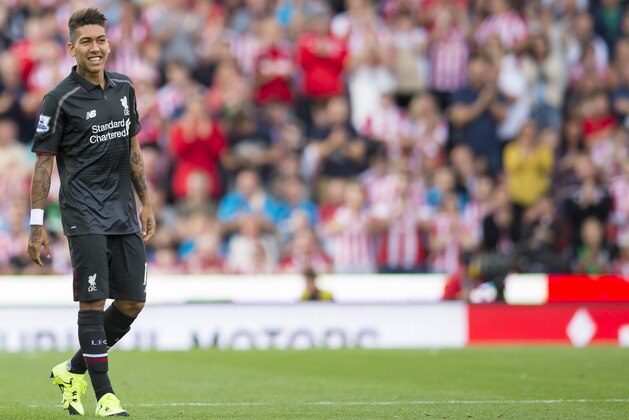 Liverpool's Roberto Firmino smiles during the English Premier League soccer match between Stoke and Liverpool at the Britannia Stadium, Stoke, England, Sunday Aug. 9, 2015. (AP Photo/Jon Super)