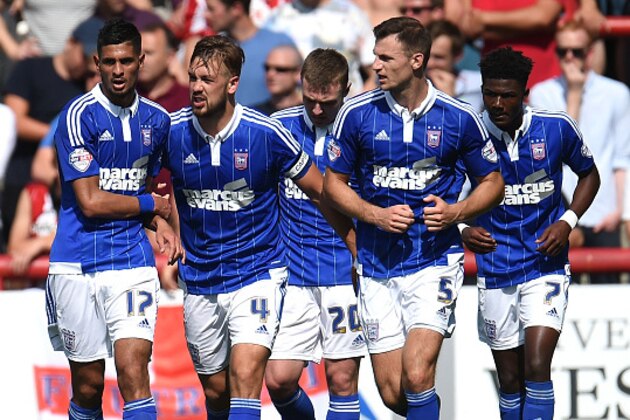 BRENTFORD, ENGLAND - AUGUST 08:  Kevin Bru (1st L) celebrates with Luke Chambers (2nd L) scoring the opening goal for Ipswich Town during the Sky Bet Championship match between Brentford and Ipswich Town at Griffin Park on August 8, 2015 in Brentford, England.  (Photo by Tom Dulat/Getty Images)