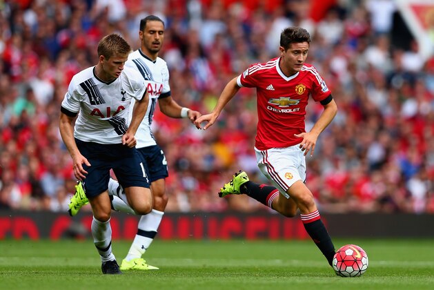MANCHESTER, ENGLAND - AUGUST 08:  Ander Herrera of Manchester United and Eric Dier of Tottenham Hotspur compete for the ball during the Barclays Premier League match between Manchester United and Tottenham Hotspur at Old Trafford on August 8, 2015 in Manchester, England.  (Photo by Clive Brunskill/Getty Images)