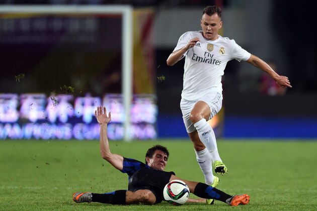 Real Madrid's Russian midfielder Denis Cheryshev (R) and Inter's Croatians midfielder Mateo Kovacic vie for the ball  during the International Champions Cup football match between Inter Milan and Real Madrid in Guangzhou on July 27, 2015. AFP PHOTO / JOHANNES EISELE        (Photo credit should read JOHANNES EISELE/AFP/Getty Images)