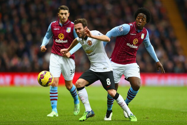 BIRMINGHAM, ENGLAND - DECEMBER 20: Juan Mata of Manchester United is tackled by Carlos Sanchez of Aston Villa  during the Barclays Premier League match between Aston Villa and Manchester United at Villa Park on December 20, 2014 in Birmingham, England.  (Photo by Clive Mason/Getty Images)