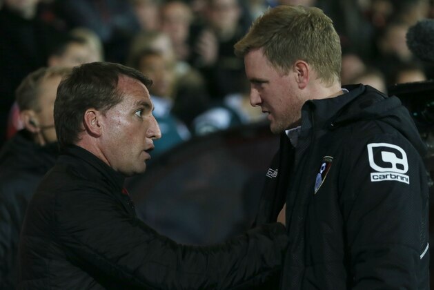 Liverpool manager Brendan Rodgers, left, and Bournemouth manager Eddie Howe speak ahead of the English League Cup soccer quarterfinal match between AFC Bournemouth and Liverpool at Goldsands Stadium, Bournemouth, Wednesday, Dec. 17, 2014. (AP Photo/Tim Ireland)