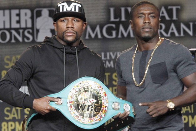 Floyd Mayweather Jr., left, and Andre Berto pose at a news conference in Los Angeles on Thursday, Aug. 6, 2015. Mayweather says Berto is a worthy opponent for the final fight of his perfect career. (AP Photo/Nick Ut)