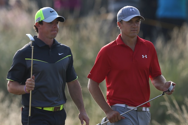 Rory McIlroy of Northern Ireland, left, and Jordan Spieth of the US walk up to the 14th tee box during the second day of the British Open Golf championship at the Royal Liverpool golf club, Hoylake, England, Friday July 18, 2014. (AP Photo/Scott Heppell)