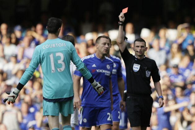 Chelsea’s Thibaut Courtois is given a red card by referee Michael Oliver during the English Premier League soccer match between Chelsea and Swansea City at Stamford Bridge, London, Saturday Aug. 8, 2015. (AP Photo/Tim Ireland)