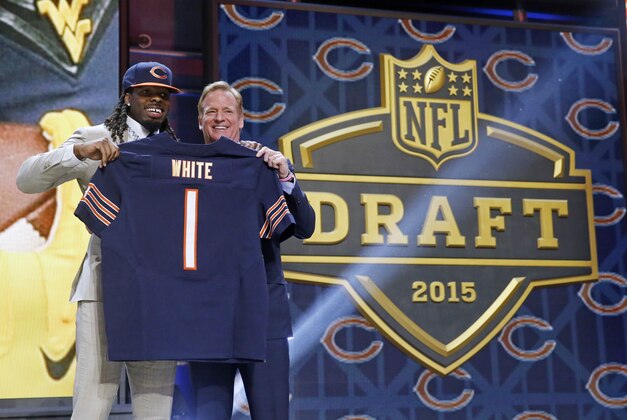 West Virginia wide receiver Kevin White poses for photos with NFL commissioner Roger Goodell after being selected by the Chicago Bears as the seventh pick in the first round of the 2015 NFL Draft,  Thursday, April 30, 2015, in Chicago. (AP Photo/Charles Rex Arbogast)