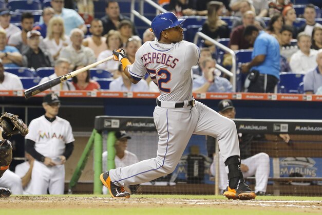 New York Mets hitter Yoenis Cespedes hits a two-RBI double in the fifth inning against the Miami Marlins during a baseball game in Miami, Monday Aug. 3, 2015. (AP Photo/Joe Skipper)