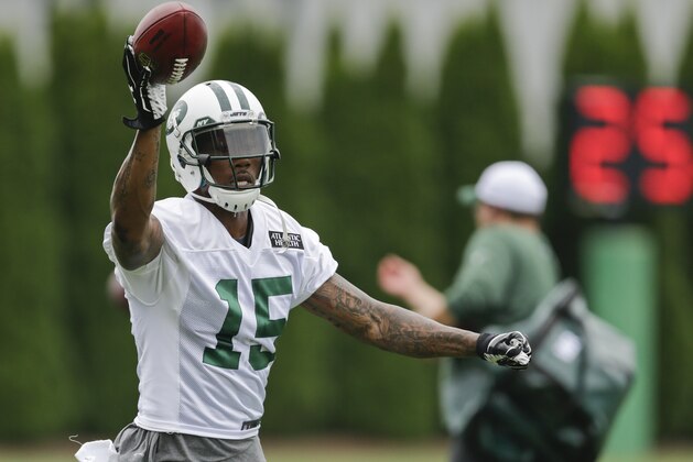 New York Jets wide receiver Brandon Marshall (15) makes a one-handed catch at NFL football training camp, Thursday, July 30, 2015, in Florham Park, N.J. (AP Photo/Frank Franklin II)