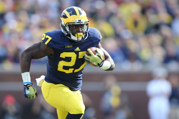 ANN ARBOR, MI - SEPTEMBER 13:  Derrick Green #27 of the University of Michigan runs for a first down during the fourth quarter of the game against the Miami University Redhawks at Michigan Stadium on September 13, 2014 in Ann Arbor, Michigan. the Wolverines defeated the Redhawks 34-10.  (Photo by Leon Halip/Getty Images)