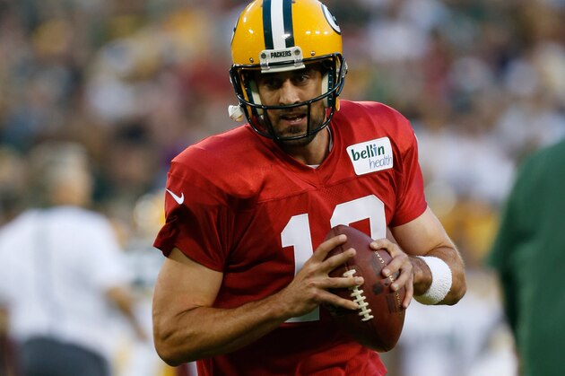 Green Bay Packers’ Aaron Rodgers (12) during the Green Bay Packers Family Fun Night NFL football training camp practice Saturday, Aug. 8 , 2015, in Green Bay, Wis. (AP Photo/Mike Roemer)