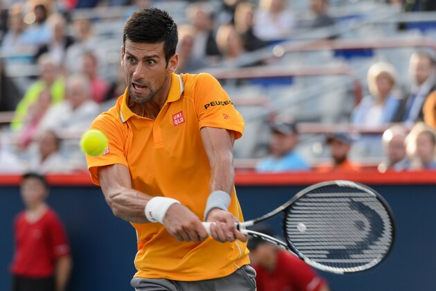 MONTREAL, ON - AUGUST 11:   Novak Djokovic of Serbia returns the ball during day two of the Rogers Cup against  Thomaz Bellucci of Brazil at Uniprix Stadium on August 11, 2015 in Montreal, Quebec, Canada.  Novak Djokovic defeated Thomaz Bellucci 6-3, 7-6.  (Photo by Minas Panagiotakis/Getty Images)