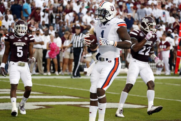 Auburn wide receiver D'haquille Williams (1) dances in the end zone after catching a touchdown pass in the first half of an NCAA college football game against Mississippi State in Starkville, Miss., Saturday, Oct 11, 2014. Mississippi State won 38-23. (AP Photo/Rogelio V. Solis)