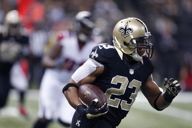 New Orleans Saints running back Pierre Thomas (23) carries in the first half of an NFL football game against the Atlanta Falcons in New Orleans, Sunday, Dec. 21, 2014. (AP Photo/Rogelio Solis)