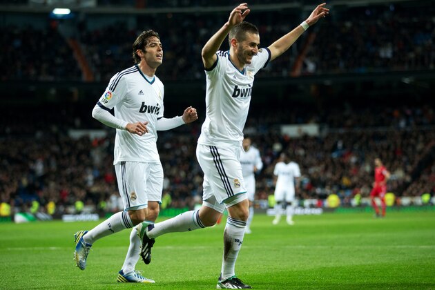 MADRID, SPAIN - FEBRUARY 09:  Karim Benzema (R) of Real Madrid celebrates scoring his sides opening goal with his teammates Kaka during the la Liga match between Real Madrid CF and Sevilla FC at Estadio Santiago Bernabeu on February 9, 2013 in Madrid, Spain.  (Photo by Jasper Juinen/Getty Images)