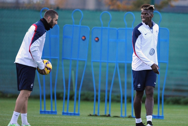 France's forward Karim Benzema (L) and midfielder Paul Pogba take part in a training session, two days before the team's friendly international football match against Sweden, on November 16, 2014, at the route de Lorient stadium in Rennes, western France. AFP PHOTO/ JEAN-FRANCOIS MONIER        (Photo credit should read JEAN-FRANCOIS MONIER/AFP/Getty Images)