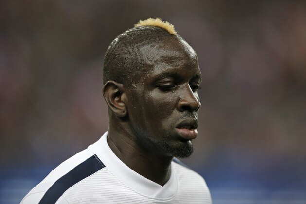 France’s Mamadou Sakho warms up prior to the international friendly soccer match between France and Brazil at the Stade de France, north of Paris, France, Thursday, March 26, 2015. (AP Photo/Francois Mori)