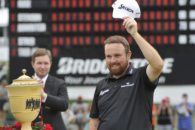 Shane Lowry of Ireland, waves to the crowd after winning the Bridgestone Invitational golf tournament, in Akron, Ohio, Sunday, Aug. 9, 2015. (AP Photo/Phil Long)