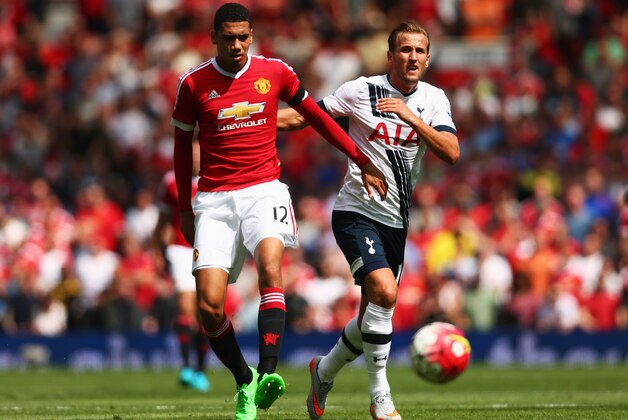 MANCHESTER, ENGLAND - AUGUST 08: Chris Smalling of Manchester United and Harry Kane of Tottenham Hotspur compete for the ball during the Barclays Premier League match between Manchester United and Tottenham Hotspur at Old Trafford on August 8, 2015 in Manchester, England. (Photo by Clive Brunskill/Getty Images) MANCHESTER, ENGLAND - AUGUST 08: Chris Smalling of Manchester United and Harry Kane of Tottenham Hotspur compete for the ball during the Barclays Premier League match between Manchester United and Tottenham Hotspur at Old Trafford on August 8, 2015 in Manchester, England. (Photo by Clive Brunskill/Getty Images)