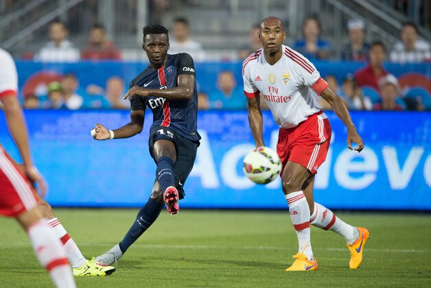 Jean-Christophe Bahebeck (15) advances the ball as Luisão (4) looks on during a game between SL Benfica and Paris Saint-Germain, on Saturday, July, 18, 2015 in Toronto, ON. (Mike Janes/AP Images for International Champions Cup)