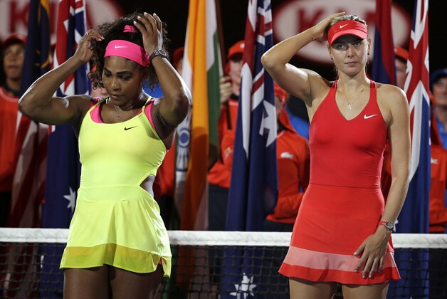Winner Serena Williams of the U.S., left, and  runner-up Maria Sharapova of Russia, right, wait for the trophy presentation after the women's singles final at the Australian Open tennis championship in Melbourne, Australia, Saturday, Jan. 31, 2015. (AP Photo/Vincent Thian)