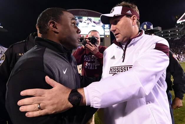 STARKVILLE, MS - NOVEMBER 22:  Head coach Dan Mullen of the Mississippi State Bulldogs and head coach Derek Mason of the Vanderbilt Commodores meet at midfield following a game at Davis Wade Stadium on November 22, 2014 in Starkville, Mississippi.  Mississippi State won the game 51-0.  (Photo by Stacy Revere/Getty Images)