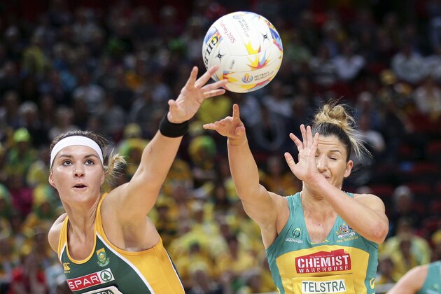 South Africa's Lenize Potgieter left, pusses the ball away from Australia's Kimberley Ravaillion during the Netball World Cup in Sydney, Australia, Wednesday, Aug. 12, 2015. (AP Photo/Rob Griffith)