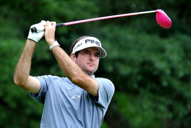 Bubba Watson watches his ball on the ninth tee during the third round of the Greenbrier Classic golf tournament at the Greenbrier Resort in White Sulphur Springs, W.Va., Saturday, July 4, 2015  (AP Photo/Chris Tilley)
