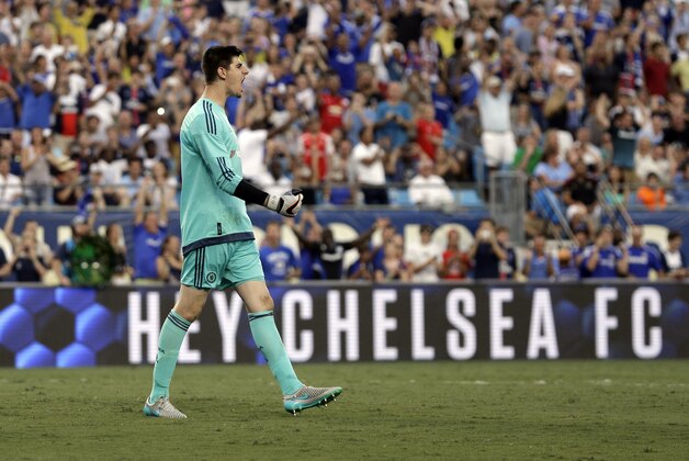 Chelsea's Thibaut Courtois celebrates after scoring on the winning penalty kick Paris Saint-Germain after the second half of an International Champions Cup soccer match in Charlotte, N.C., Saturday, July 25, 2015. Chelsea won 2-1 on penalty kicks. (AP Photo/Chuck Burton)