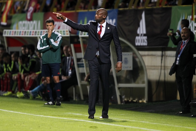 FILE -  In this June 11, 2015 file photo, Costa Rica's coach Paulo Wanchope stands on the sidelines pointing during an international friendly soccer match between Spain and Costa Rica at the Reino de Leon stadium in Leon, Spain. Videos show Wanchope in a fistfight at an under-23 match in Panama, Tuesday, Aug, 11, 2015. Local news reports indicate Wanchope was irritated at refereeing during Tuesday night’s pre-Olympic match, which ended in a scoreless draw. (AP Photo/J.M. Lopez, File)