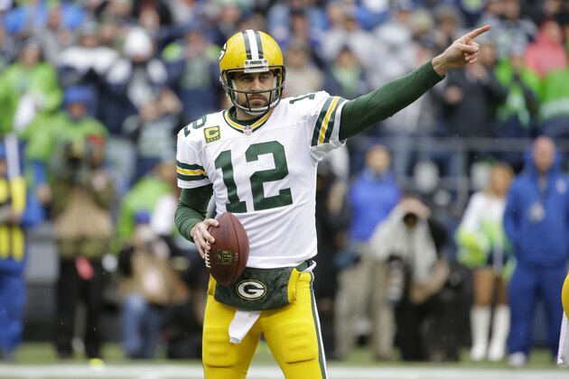 Green Bay Packers quarterback Aaron Rodgers (12) points off sides against the Seattle Seahawks during the first half of the NFL football NFC Championship game Sunday, Jan. 18, 2015, in Seattle. (AP Photo/Ted S. Warren)
