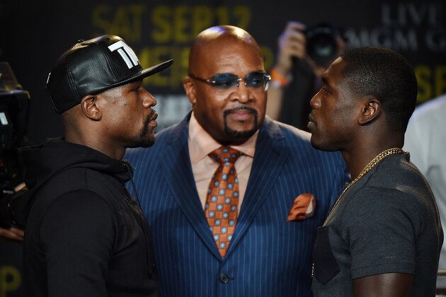 Boxers Floyd 'Money' Mayweather (L) and Andre Berto (R) face off during a press conference to officially announce their September 12 fight that will place at the MGM Grand Garden Arena in Las Vegas, at the Marriott Hotel in Los Angeles, California on August 6, 2015.  Mayweather claims it will be the last ever opportunity to see him fight.          AFP PHOTO / MARK RALSTON        (Photo credit should read MARK RALSTON/AFP/Getty Images)