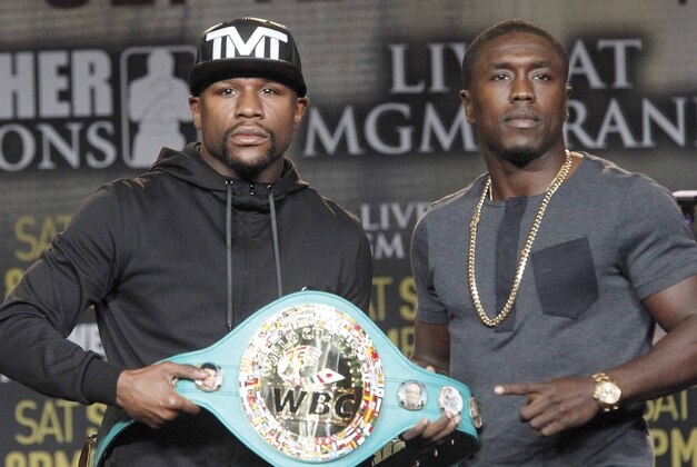 Floyd Mayweather Jr., left, and Andre Berto pose at a news conference in Los Angeles on Thursday, Aug. 6, 2015. Mayweather says Berto is a worthy opponent for the final fight of his perfect career. (AP Photo/Nick Ut)