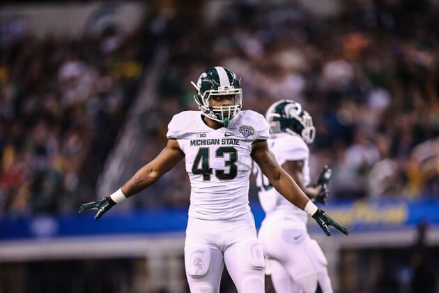 ARLINGTON, TX - JANUARY 1:  Ed Davis #43 of the Michigan State Spartans reacts against the Baylor Bears during the Goodyear Cotton Bowl Classic at AT&T Stadium on January 1, 2015 in Arlington, Texas. (Photo by Rey Del Rio/Getty Images)