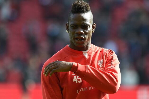 Liverpool's Italian striker Mario Balotelli warms up ahead of the English Premier League football match between Liverpool and Manchester United at Anfield in Liverpool, north west England on March 22, 2015. AFP PHOTO / PAUL ELLIS

RESTRICTED TO EDITORIAL USE. NO USE WITH UNAUTHORIZED AUDIO, VIDEO, DATA, FIXTURE LISTS, CLUB/LEAGUE LOGOS OR LIVE SERVICES. ONLINE IN-MATCH USE LIMITED TO 45 IMAGES, NO VIDEO EMULATION. NO USE IN BETTING, GAMES OR SINGLE CLUB/LEAGUE/PLAYER PUBLICATIONS.        (Photo credit should read PAUL ELLIS/AFP/Getty Images)