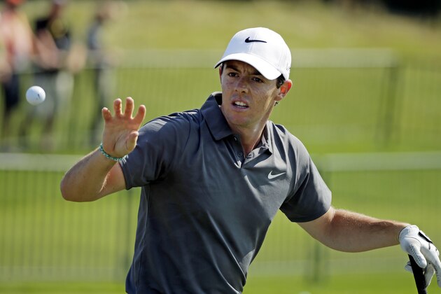 Rory McIlroy, of Northern Ireland, catches a ball on the range before a practice round for the PGA Championship golf tournament Wednesday, Aug. 12, 2015, at Whistling Straits in Haven, Wis. (AP Photo/Chris Carlson)