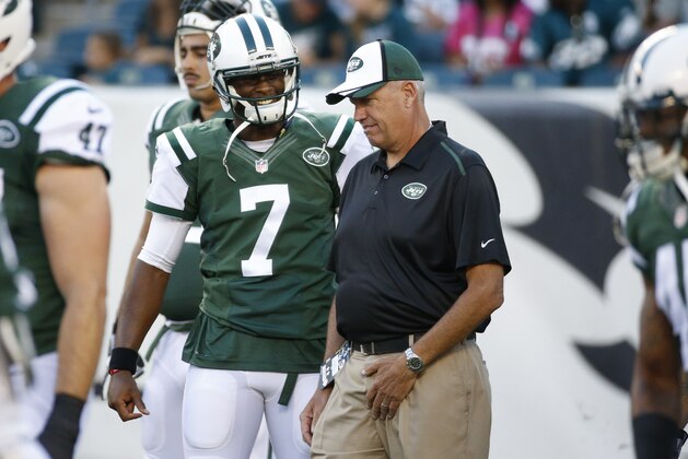 New York Jets' Geno Smith, left, talks things over with head coach Rex Ryan, right, during warm-ups prior to an NFL preseason football game against the Philadelphia Eagles, Thursday, Aug. 28, 2014, in Philadelphia. The Eagles won 37-7. (AP Photo/Chris Szagola)