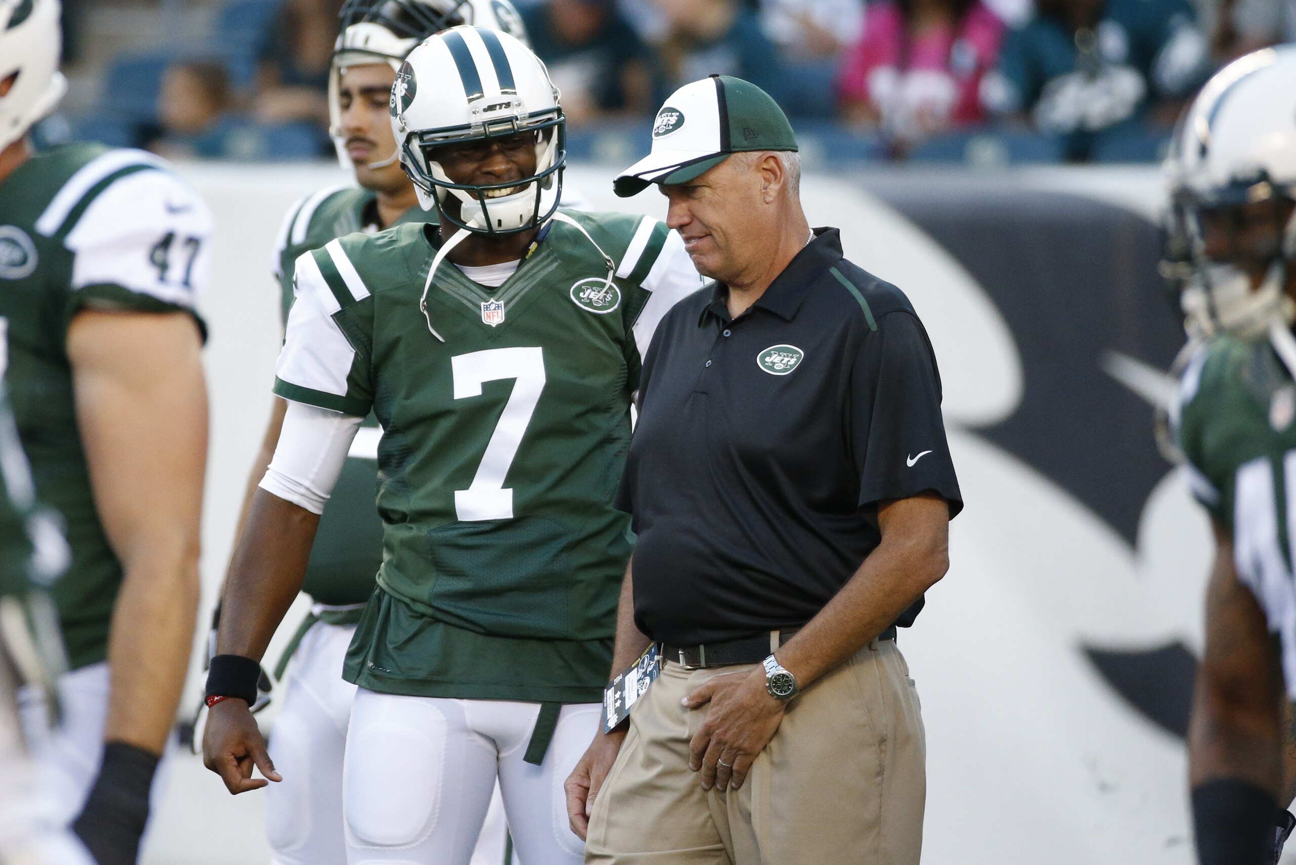 New York Jets' Geno Smith, left, talks things over with head coach Rex Ryan, right, during warm-ups prior to an NFL preseason football game against the Philadelphia Eagles, Thursday, Aug. 28, 2014, in Philadelphia. The Eagles won 37-7. (AP Photo/Chris Szagola)