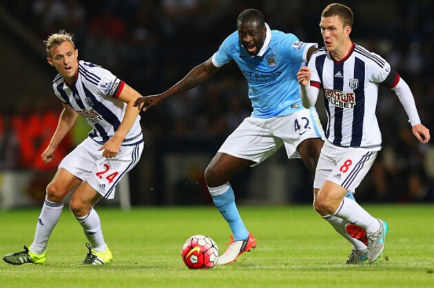 WEST BROMWICH, ENGLAND - AUGUST 10:  Yaya Toure of Manchester City battles with Darren Fletcher (24) and Craig Gardner of West Bromwich Albion (8) during the Barclays Premier League match between West Bromwich Albion and Manchester City at The Hawthorns on August 10, 2015 in West Bromwich, England.  (Photo by Alex Livesey/Getty Images)