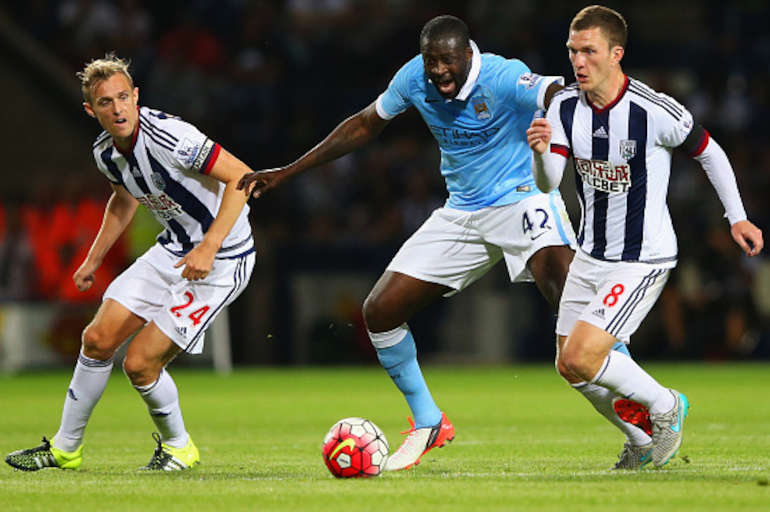 WEST BROMWICH, ENGLAND - AUGUST 10:  Yaya Toure of Manchester City battles with Darren Fletcher (24) and Craig Gardner of West Bromwich Albion (8) during the Barclays Premier League match between West Bromwich Albion and Manchester City at The Hawthorns on August 10, 2015 in West Bromwich, England.  (Photo by Alex Livesey/Getty Images)