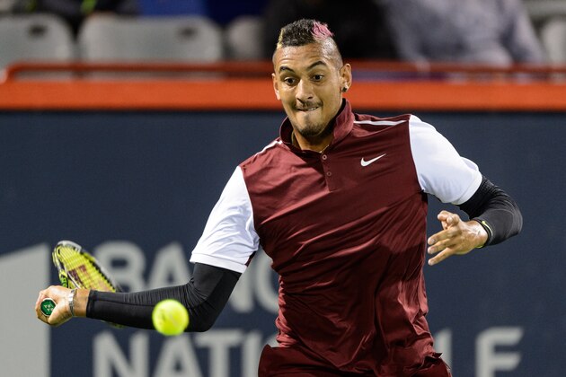 MONTREAL, ON - AUGUST 12:  Nick Kyrgios of Australia hits a return against Stan Wawrinka of Switzerland during day three of the Rogers Cup at Uniprix Stadium on August 12, 2015 in Montreal, Quebec, Canada.  (Photo by Minas Panagiotakis/Getty Images)