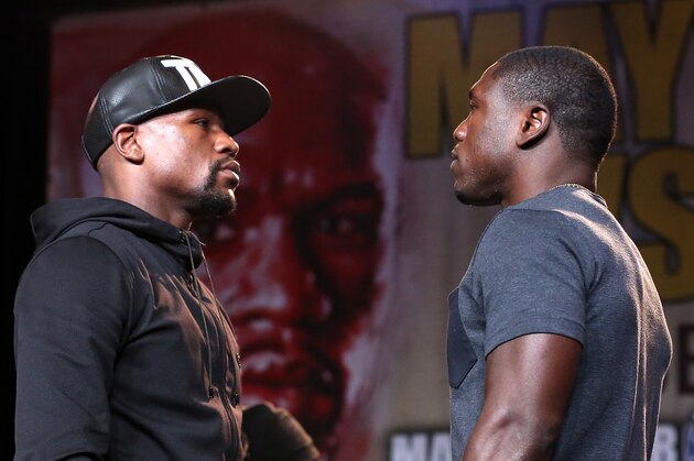 LOS ANGELES, CA - AUGUST 06:  Floyd Mayweather (L) and Andre Berto face off at a press conference ahead of the upcoming fight at JW Marriott Los Angeles at L.A. LIVE on August 6, 2015 in Los Angeles, California.  (Photo by Stephen Dunn/Getty Images)